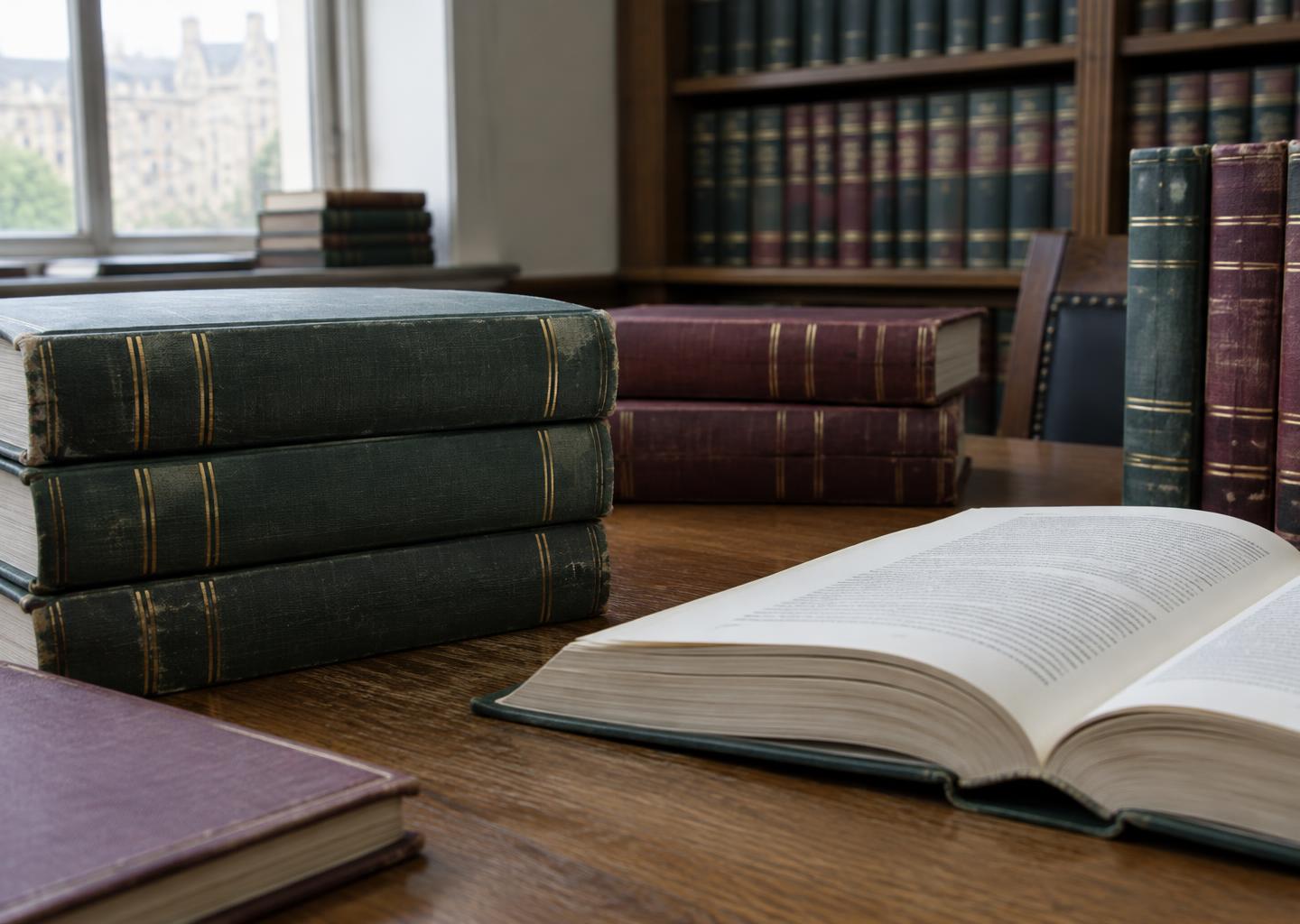 Law reference books in a library, illustrative image